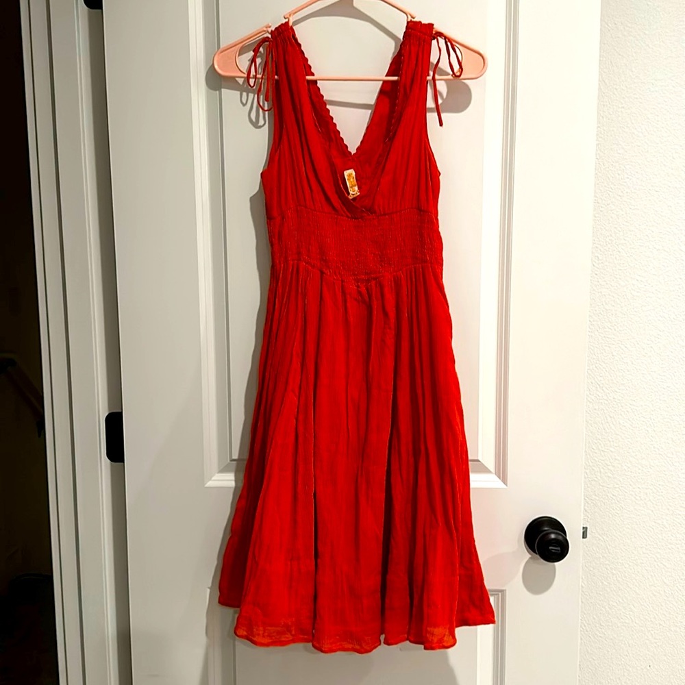 Beautiful pumpkin orange flirty dress!